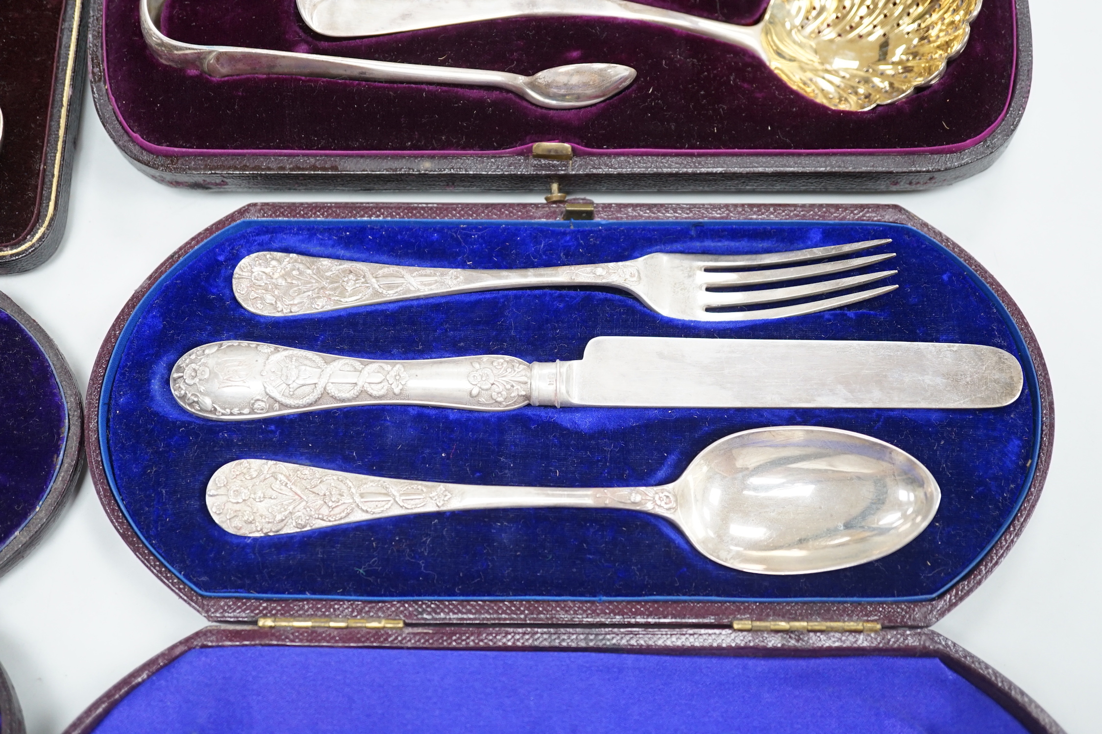Four cased sets of silver cutlery including apostle spoons and christening sets.